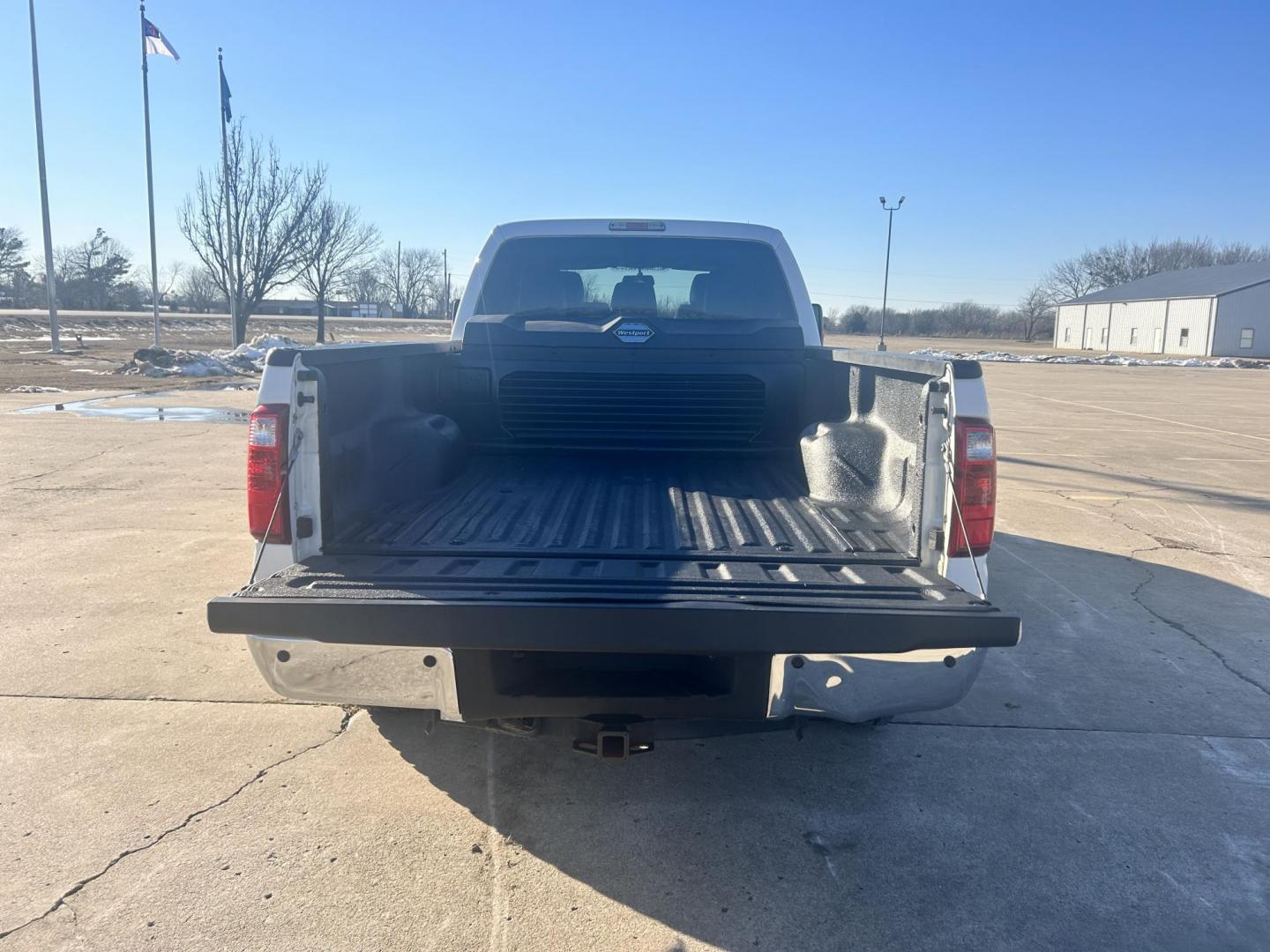 2013 White /Gray Ford F-250 SD SUPER DUTY (1FT7W2B65DE) with an 6.2L V8 OHV 16V engine, 6-Speed Automatic transmission, located at 17760 Hwy 62, Morris, OK, 74445, (918) 733-4887, 35.609104, -95.877060 - 2013 FORD F250 SUPER DUTY 4WD WITH THE 6.2L ENGINE BI-FUEL SYSTEM RUNS ON CNG OR GASOLINE. FEATURES LEATHER INTERIOR, POWER LOCKS, POWER WINDOWS, POWER MIRRORS, CRUISE CONTROL, TRACTION CONTROL, AUXILIARY PORT, AM/FM RADIO, CD PLAYER , A/C, BEDLINER, AND HITCH. THIS TRUCK RUNS ON CNG (COMPRESSED NA - Photo#16