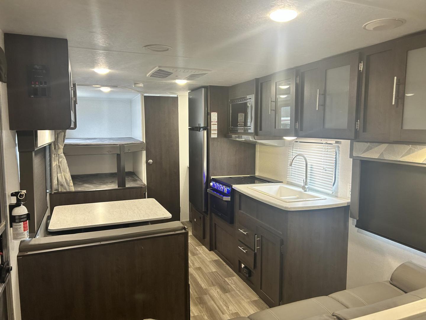 2020 BLACK /TAN Forest River CRUISE LITE 261BHXL (4X4TSMB29L7) , located at 17760 Hwy 62, Morris, OK, 74445, 35.609104, -95.877060 - 2020 FOREST RIVER CRUISE LITE 261BHXL 28FT OVERALL WITH 11FT POWER AWNING. IN THE FRONT IS A QUEEN SIZE BED WITH OVERHEAD SHELF AND STORAGE UNDER BED, 2 WARDROBE CLOSETS. IN THE LIVING/KITCHEN AREA IS A LEATHER SOFA THAT FOLDS DOWN FOR ADDITIONAL SLEEPING, BOOTH STYLE DINETTE THAT FOLDS FOR ADDITIO - Photo#15