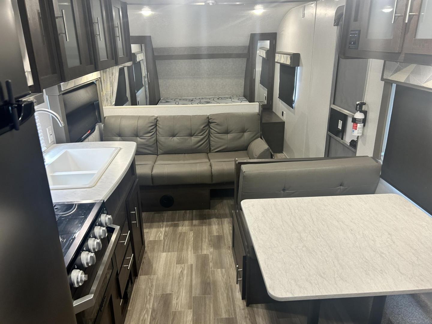 2020 BLACK /TAN Forest River CRUISE LITE 261BHXL (4X4TSMB29L7) , located at 17760 Hwy 62, Morris, OK, 74445, 35.609104, -95.877060 - 2020 FOREST RIVER CRUISE LITE 261BHXL 28FT OVERALL WITH 11FT POWER AWNING. IN THE FRONT IS A QUEEN SIZE BED WITH OVERHEAD SHELF AND STORAGE UNDER BED, 2 WARDROBE CLOSETS. IN THE LIVING/KITCHEN AREA IS A LEATHER SOFA THAT FOLDS DOWN FOR ADDITIONAL SLEEPING, BOOTH STYLE DINETTE THAT FOLDS FOR ADDITIO - Photo#28