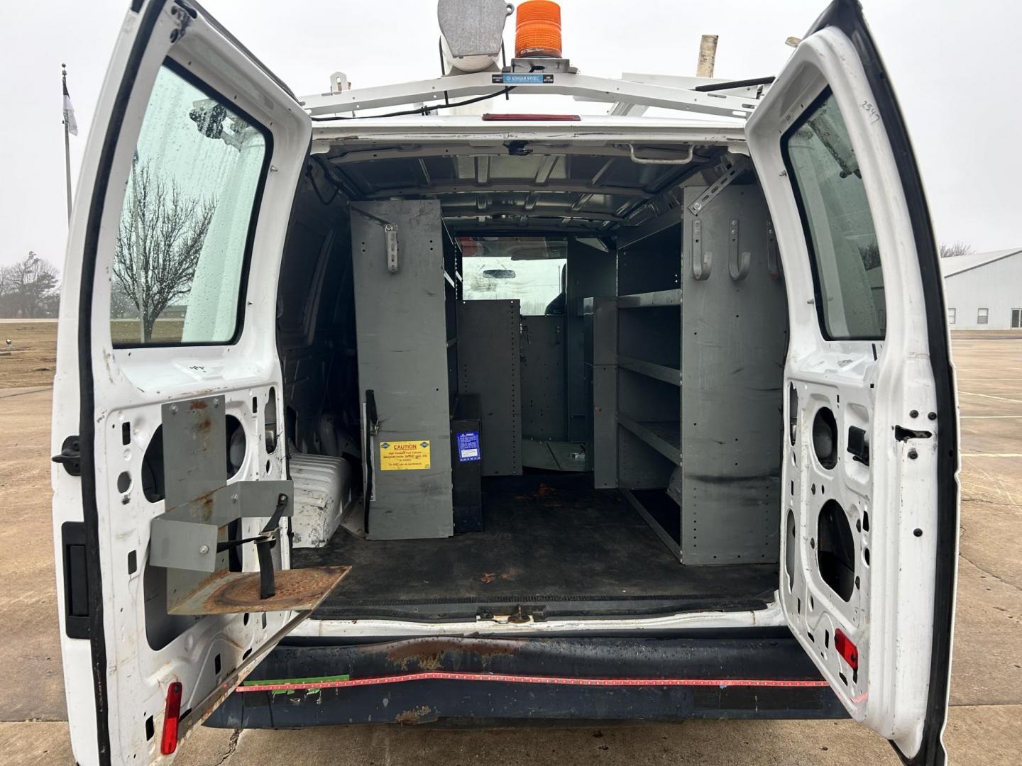 2010 White /Gray Ford E-Series Van E-250 (1FTNE2EL1AD) with an 5.4L V8 SOHC 16V engine, 4-Speed Automatic transmission, located at 17760 Hwy 62, Morris, OK, 74445, (918) 733-4887, 35.609104, -95.877060 - 2010 FORD E-SERIES VAN E-250 5.4 V8 DEDICATED CNG (COMPRESSED NATURAL GAS) DOES NOT RUN ON GASOLINE. FEATURES MANUAL SEATS, MANUAL LOCKS, MANUAL WINDOWS, MANUAL MIRRORS, AM/FM STEREO. IT IS EQUIPPED WITH A CNG FUELING SYSTEM, IT RUNS ON COMPRESSED NATURAL GAS. A PREMIER ALTERNATIVE FUEL THAT IS EXTR - Photo#14