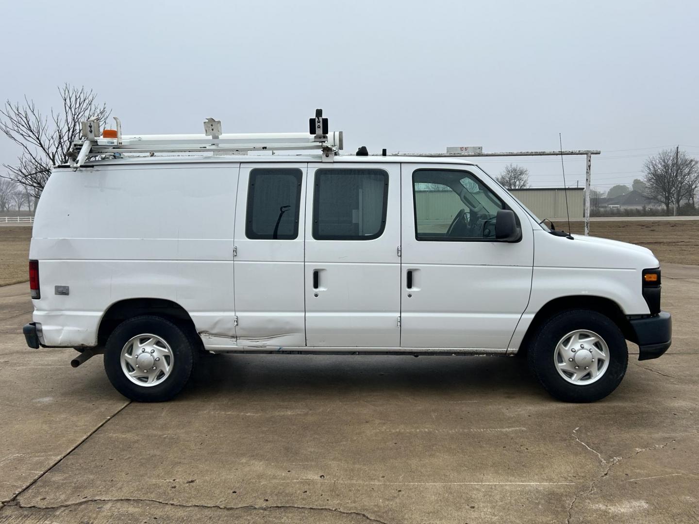 2010 White /Gray Ford E-Series Van E-250 (1FTNE2EL1AD) with an 5.4L V8 SOHC 16V engine, 4-Speed Automatic transmission, located at 17760 Hwy 62, Morris, OK, 74445, (918) 733-4887, 35.609104, -95.877060 - 2010 FORD E-SERIES VAN E-250 5.4 V8 DEDICATED CNG (COMPRESSED NATURAL GAS) DOES NOT RUN ON GASOLINE. FEATURES MANUAL SEATS, MANUAL LOCKS, MANUAL WINDOWS, MANUAL MIRRORS, AM/FM STEREO. IT IS EQUIPPED WITH A CNG FUELING SYSTEM, IT RUNS ON COMPRESSED NATURAL GAS. A PREMIER ALTERNATIVE FUEL THAT IS EXTR - Photo#3